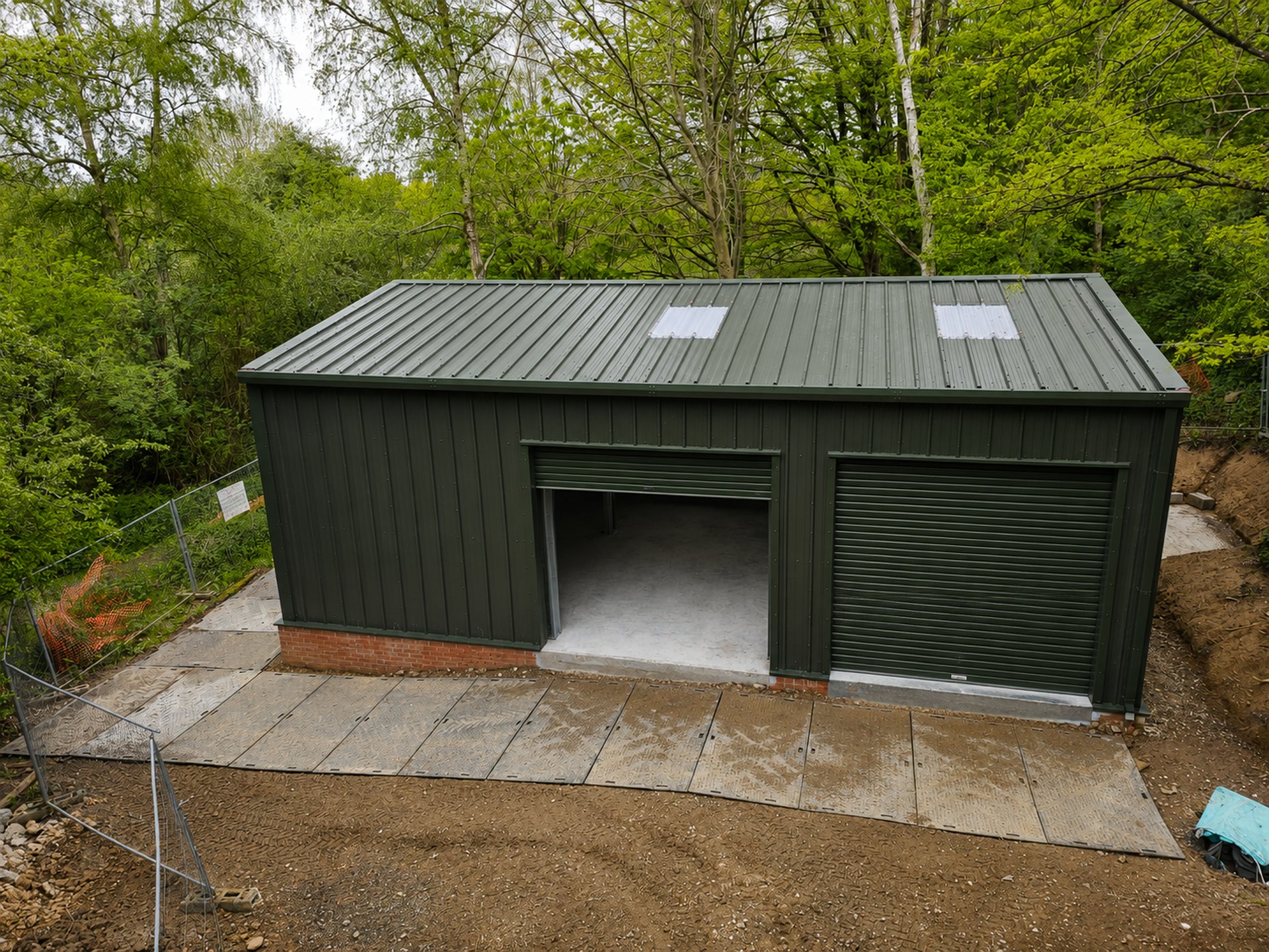 domestic steel double garage woodland setting
